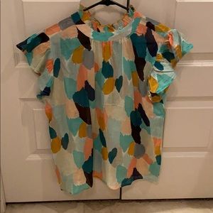 Cute flutter sleeve shirt.